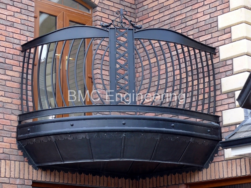 Curved Wrought Iron Balcony with Ornate Lattice Detailing