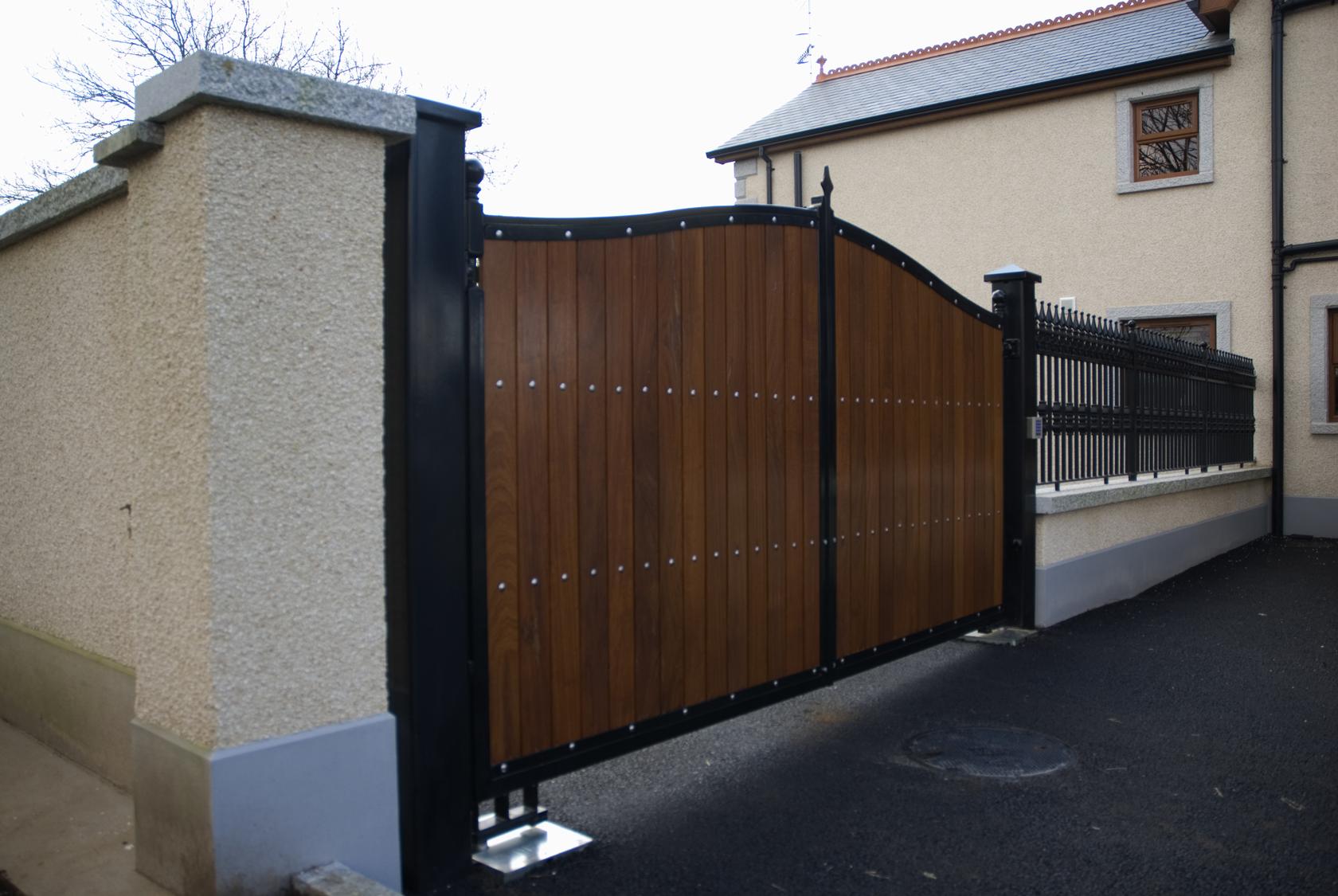 Automated Hardwood Driveway Gates with Black Metal Frame