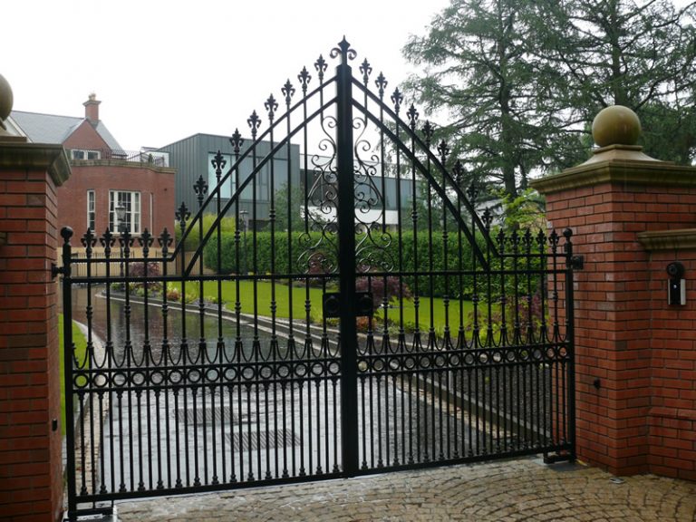 Gothic-Arched Wrought Iron Driveway Gates with Fleur-de-Lis Finials