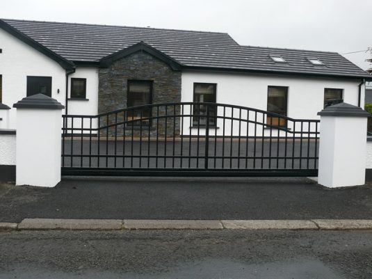 Modern Arched Sliding Driveway Gates in Black Steel