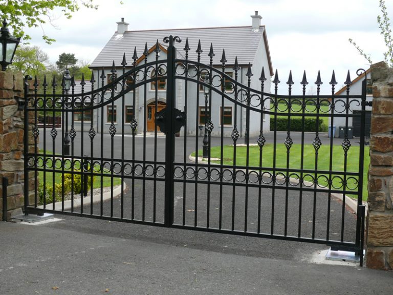 Bespoke Arched Wrought Iron Driveway Gates with Cage Finials