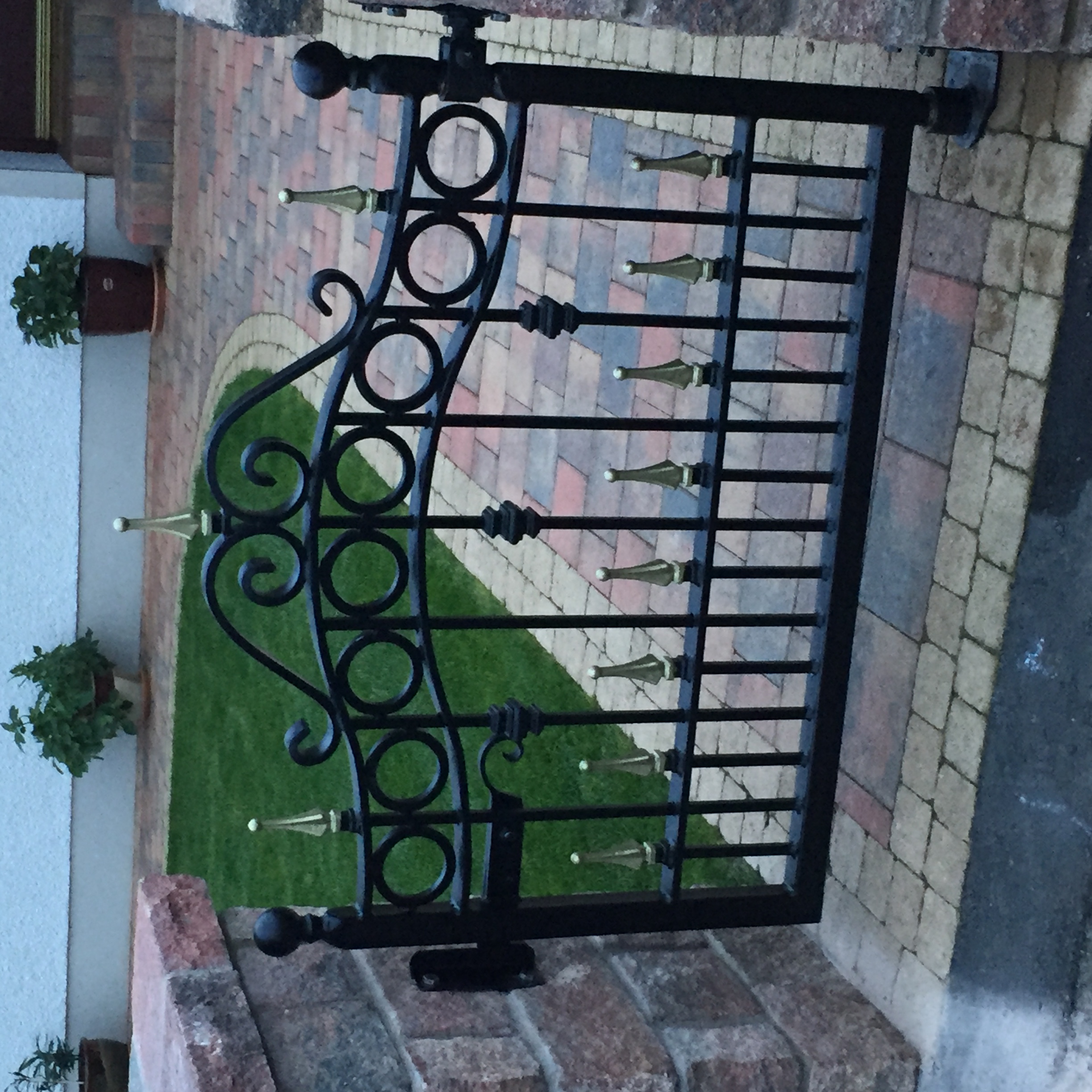 Ornate Black and Gold Wrought Iron Garden Gate