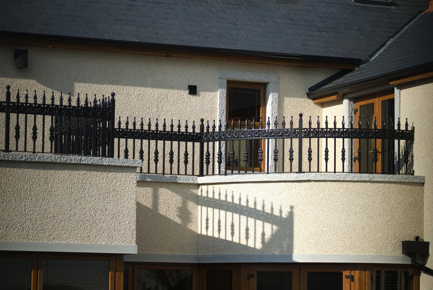 Ornate Wrought Iron Balcony Railings with Floral Banding