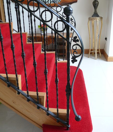 Elegant Wrought Iron Staircase Balustrade with Scroll and Circular Motifs